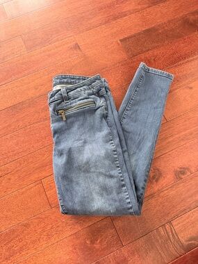 Michael Kors Light Blue Skinny Jeans with Zip Accent and Gold Emblem on Pocket